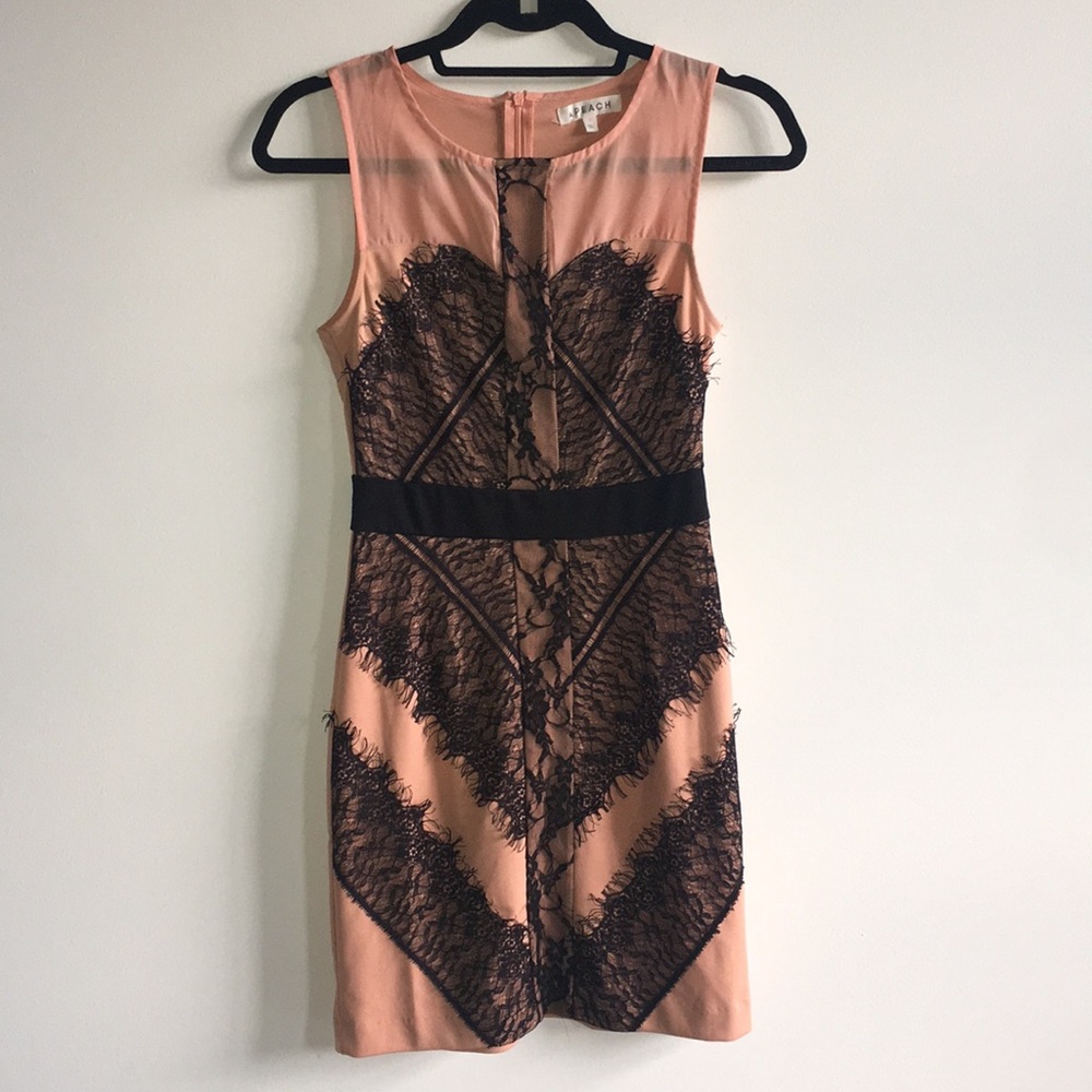 Peach form fitting mini dress w/ black lace